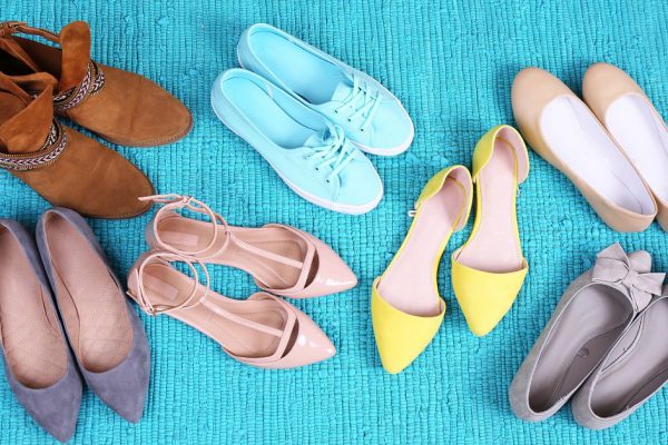 Female fashion shoes on blue carpet