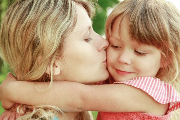 happy parent mother with child play outdoors in the park