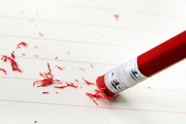 closeup of a pencil eraser correcting a mistake