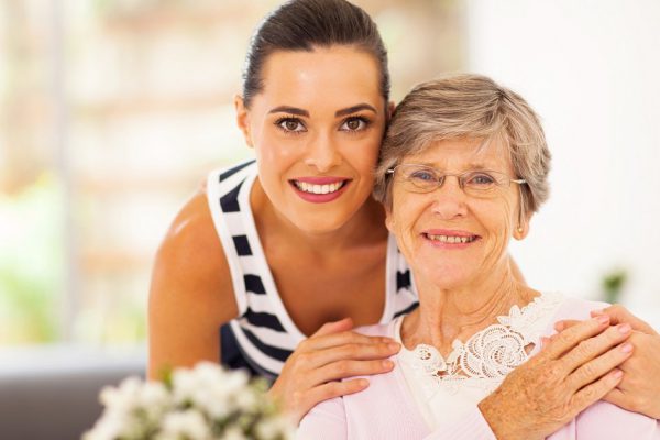 pretty woman and senior mother at home