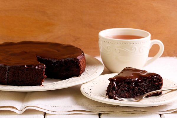 Chocolate fudge cake with berries under chocolate icing