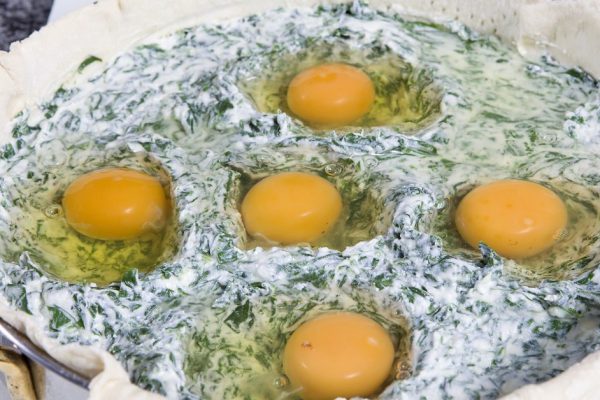 preparing Easter pie. Eggs in stuffing