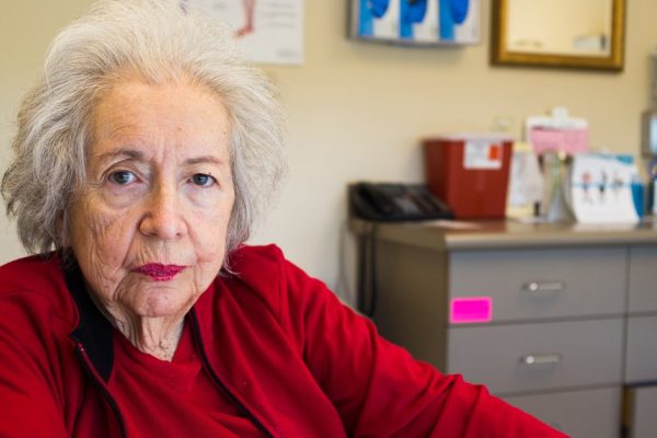 Elderly eighty plus year old woman in a medical office setting.