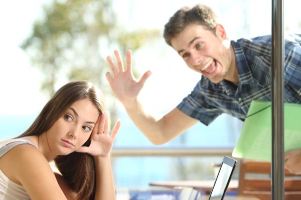 Girl ignoring a stalker man waving