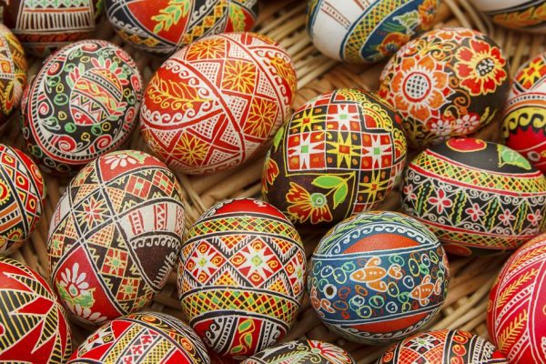 Multicolored Easter eggs in a basket closeup