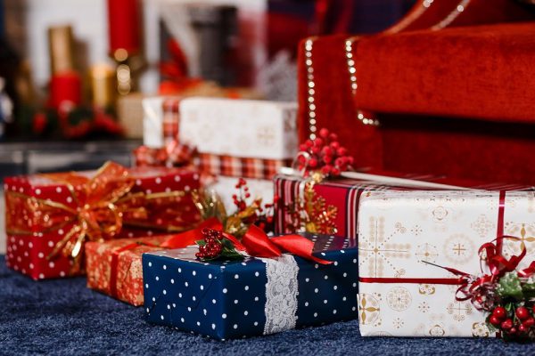 packed Christmas gifts, gift boxes, red velvet sofa