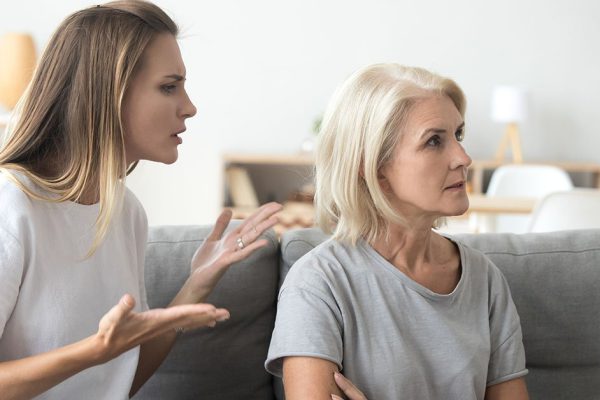 Annoyed adult daughter arguing with stubborn old senior mother in law ignoring not listening to young woman talking explaining problem, different generations disagreements family conflicts concept