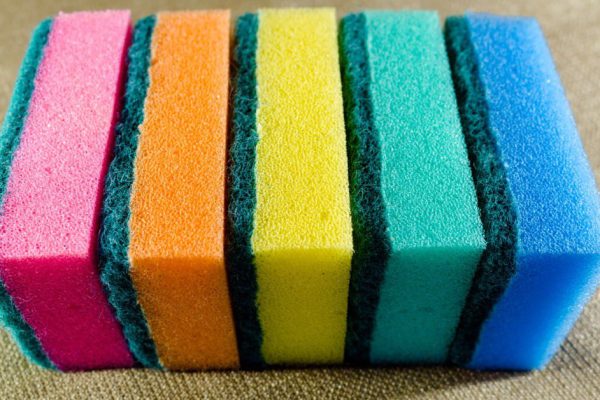 Multi-colored sponges in a row. Microfiber material. Dish washing.