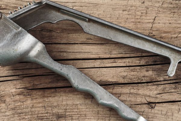 Straw chopper garlic on old wooden boards