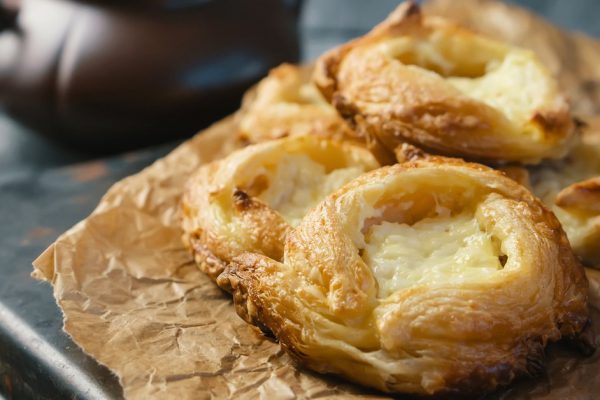 Packs puff pastry of cheese, home-European. Home making buns for tea.