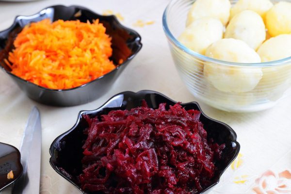 Ingredients for preparing russian traditional salad 'herring under fur coat'