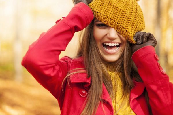 Young woman have fun with autumn clothes