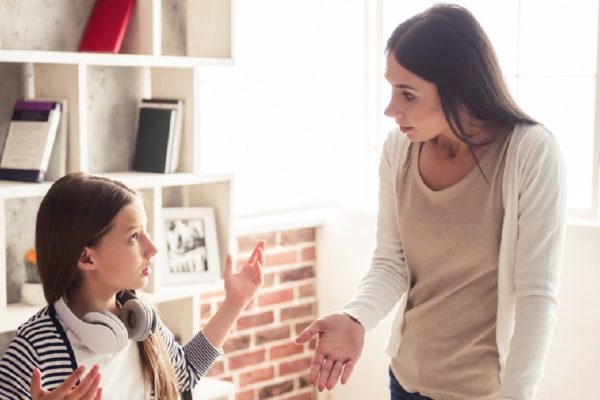 Troubled teenage girl and her mom are quarreling at home