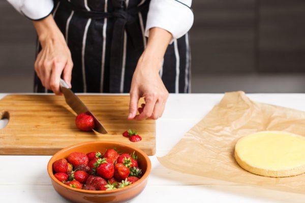 homemade preparing strawberry tart on white wooden desk