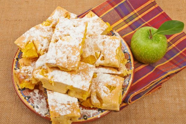 Homemade cake orange apple charlotte on tablecloths and canvas