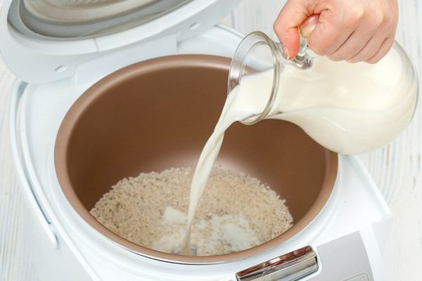 The process of cooking rice porridge in multicooker closeup