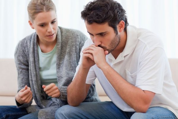 Man being mad at his fiance in their living room