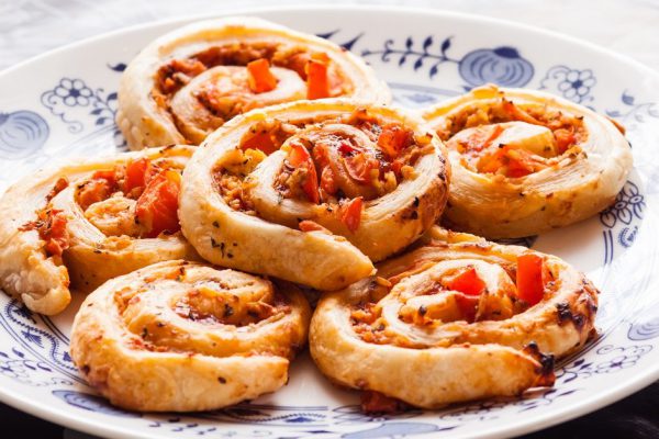 Small Pizza slugs on a plate with puff pastry