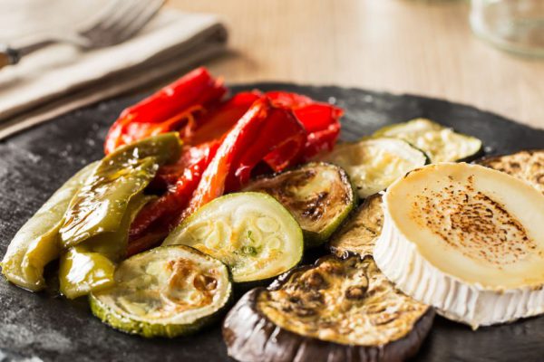 Healthy grilled vegetables on a wooden table.