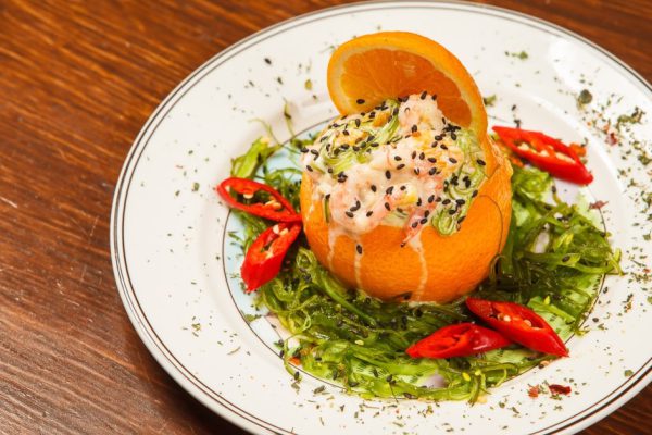 Stuffed with shrimp orange on a white plate