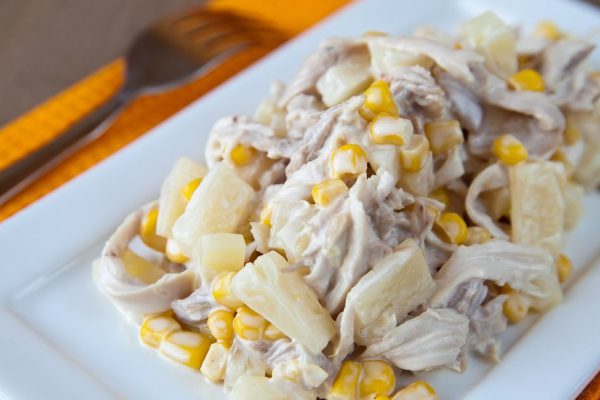 close-up fresh salad with chicken, pineapple and corn