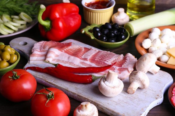 Different products on wooden table close up