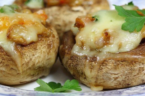 Delicious stuffed mushrooms with meat and cheese.