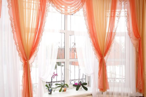 the windows decorated with curtains with a machine embroidery, double 12