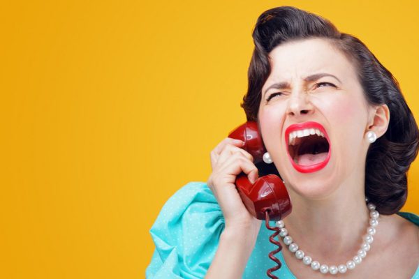 Vintage Woman shouting into telephone