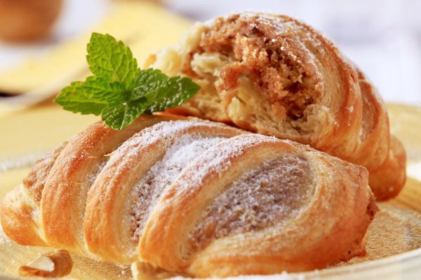 Sweet puff pastry rolls with nut filling
