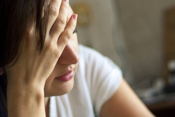 An image of girl with headache