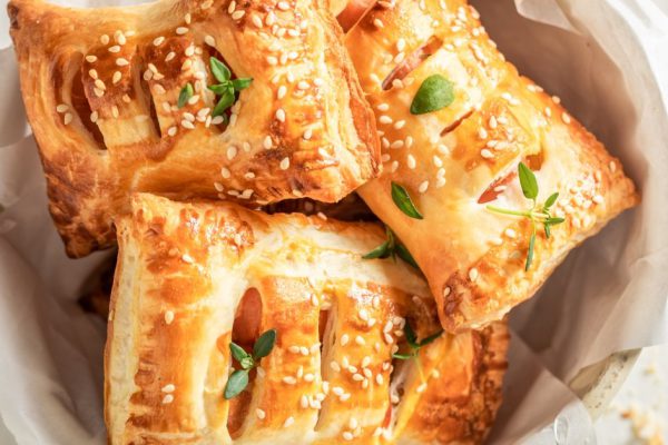 Delicious sausage in puff pastry as a snack for breakfast