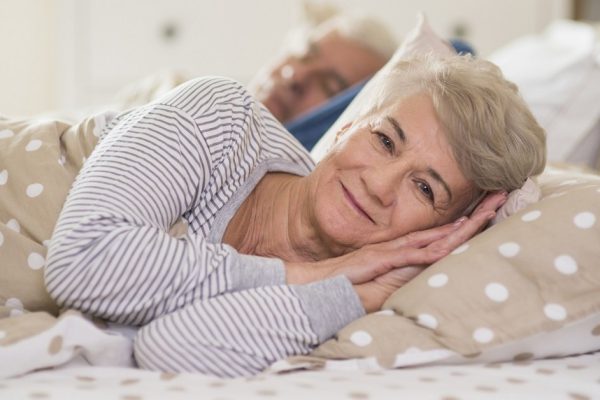 Awaken woman and her husband behind