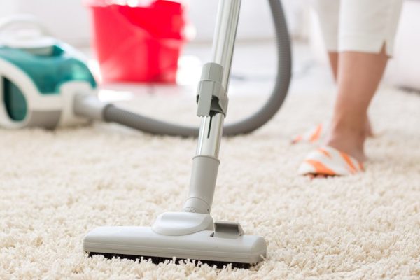 Suction grey carpet cleaning with vacuum cleaner