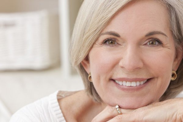 Portrait of an attractive elegant senior woman relaxing at home.
