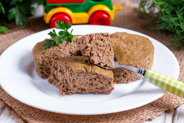Liver souffle in a white bowl on the table. Children's recipes.