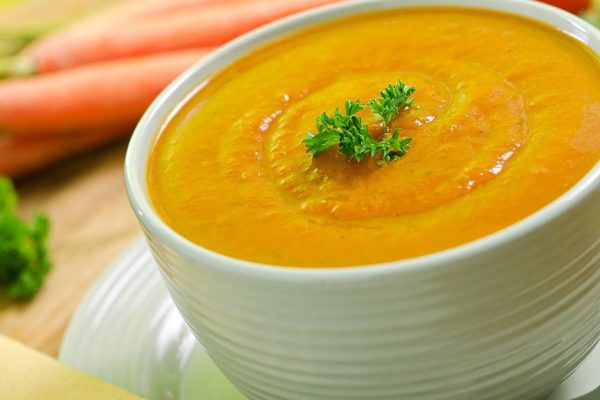 A hearty bowl of creamy carrot soup.