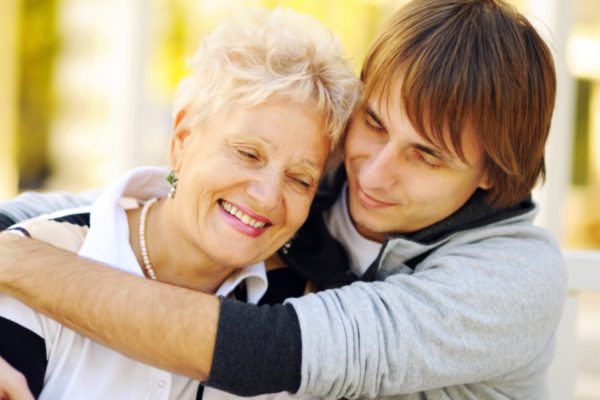 Mother and son having a hug