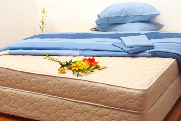 Mattress with sheets and pillows