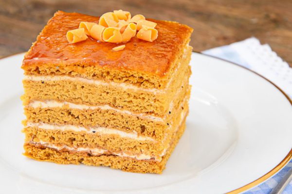 Delicious Honey Cake Decorated with Chocolate. Studio Photo