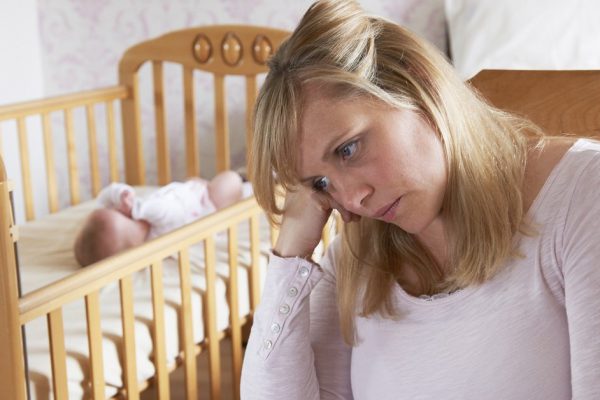 Mother In Nursery Suffering From Post Natal Depression