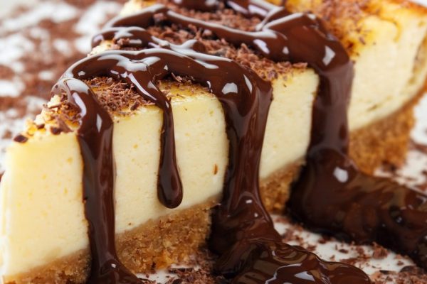 *** Local Caption *** Cheesecake slice with melted and crushed chocolate