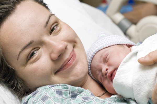Happy mother with newborn baby
