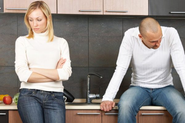 The image of quarrel of a married couple on kitchen