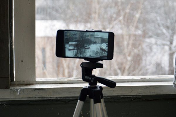 Taking photos and videos on a smartphone with a the tripod