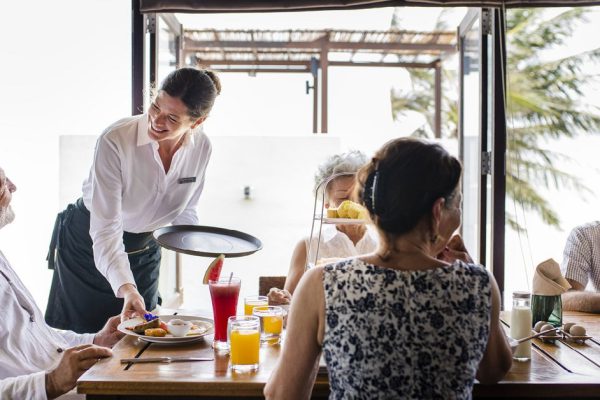 Friends having breakfast at a hotel