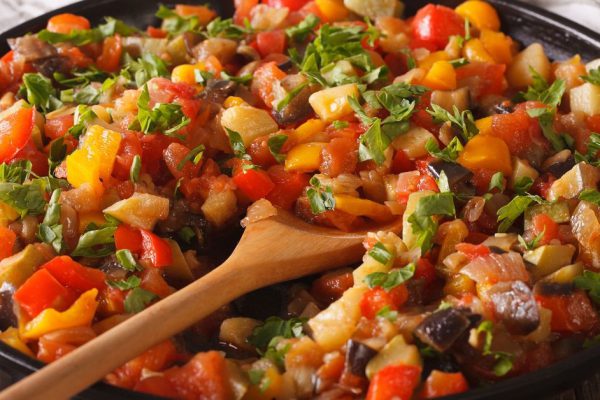 56413466 - spanish cuisine: vegetable stew pisto manchego macro on a plate on the table. horizontal