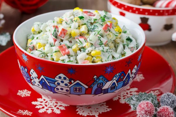 Salad with crab sticks, corn, cucumber, and rice