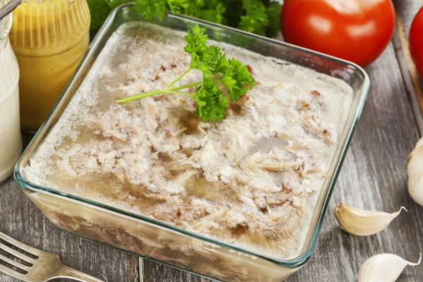 Homemade jelly meat with mustard and horseradish on the table. Holodets