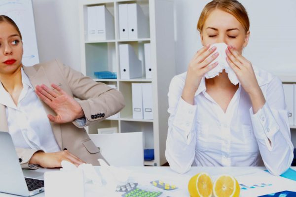 People with cold and flu  at work place